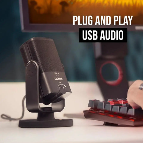 NT-USB Mini Condenser USB Microphone For Podcasting, Streaming, Gaming And Music Production next to keyboard in a setup