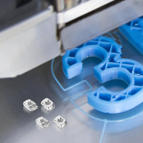 Kick Your 3d Printer Game Up With 40 Piece M3 T Slot Nuts Made From Tough Carbon Steel That Slide Smoothly Into Channels For Super Fast Mods And Upgrades On Your CNC Router Or Custom Builds - close-up of M3 T Slot nuts on a 3D printer platform.