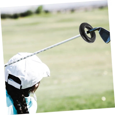 Woman practicing golf with Two Pack Weighted Golf Swing Trainer Rings For Beginners, Warm Up Practice Tool To Boost Your Swing Power And Stability