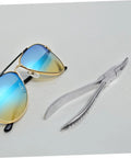 Stainless Steel Eyeglasses Repair Tool With Angled Pliers next to sunglasses for adjusting frames quick and easy eyewear fixes.