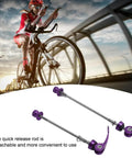Cyclist on road with 2 Pack Bicycle Quick Release Skewers Aluminum Alloy Front And Rear Wheel Axle Clips 100mm 135mm Purple below