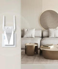 AX1800 WiFi 6 Range Extender With Ethernet Port Dual Band Repeater shown mounted on a living room wall