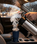 Boss Level 24v Electric Water Kettle For Truckers And Road Warriors 750ml Stainless Steel pouring hot drink into YETI travel mug in car.