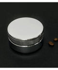 Straight Up Game Changer 58mm Stainless Steel Espresso Coffee Distributor And Adjustable Palm Tamper against a dark background.