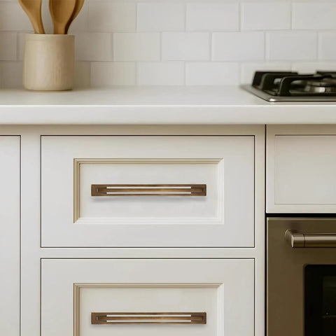 Five Piece Heavy Duty Antique Brass Cabinet Pulls With Backplates 5 Inch Center To Center Handles on white kitchen drawer.