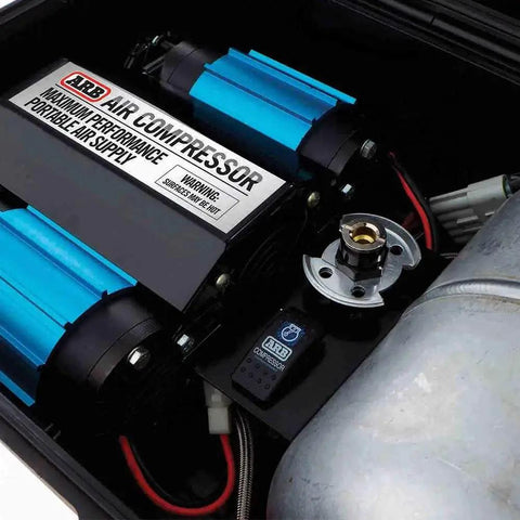 Close-up of Heavy Duty Road Trip Ready 12 Volt Twin Motor Portable Air Compressor's dual motors and pressure settings.