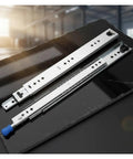 High Octane Heavy Duty Side Mount Ball Bearing Drawer Slides With Triple Extension Full Reach Cold Rolled Steel Cabinet Rails on dark surface.