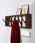 Premium Handcrafted Solid Wood Wall Mounted Coat Rack Featuring Retractable Hooks with a red scarf and framed art.