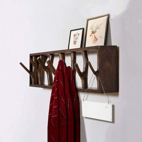 Premium Handcrafted Solid Wood Wall Mounted Coat Rack Featuring Retractable Hooks with a red scarf and framed art.