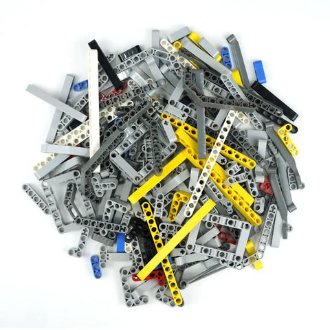 Pile of components from 582 Piece Dope Tech Parts Set With Beams Axles Connectors Pins Panels For Building Blocks And Robot Kits