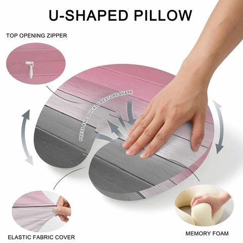 Hand pressing U Shaped Memory Foam Travel Neck Pillow With Pink Wood Grain Finish showing features like zipper and fabric cover