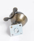 Antique-style metal caster with circular mounting plate, focusing on design details, for heavy furniture movement.