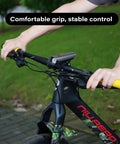 Person holding mountain bike with Yellow MTB Grips For Mountain Bikes And BMX With Double Aluminum Lock Ring Grippy TPR Rubber