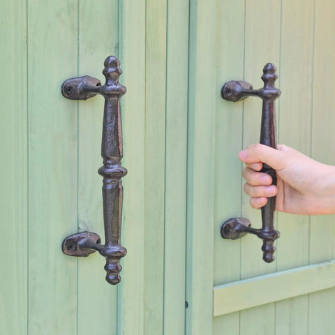 Two Pack Rustic Cast Iron Cabinet Handles Heavy Duty 9.3 Inch Long Door Pulls For Cabinets Doors Gates Closets Drawers With Antique Farmhouse Charm Built To Last And Easy To Install, installed on a green cabinet
