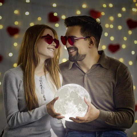 Couple smiling while holding 3D Printed Moon Lamp Night Light With Touch Control, USB Rechargeable, Adjustable Brightness In Warm White and Cool White, 7.1 Inch Globe With Realistic Lunar Surface, Dope Gift for Kids and Women