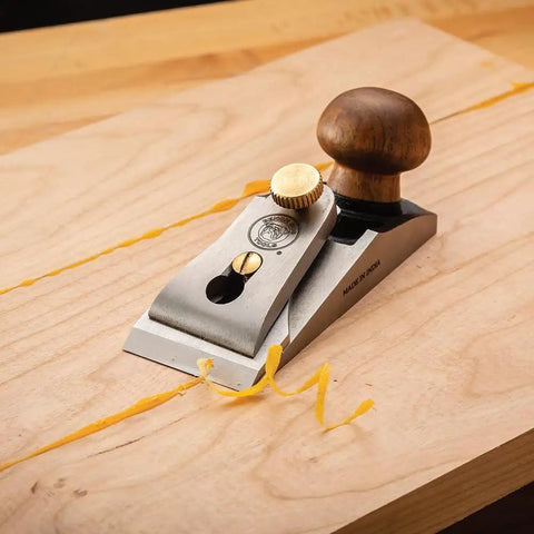 Bench Dog Small Chisel Plane Durable Flush Plane With Hardened Blade on wooden board shavings in workshop