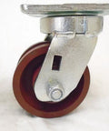 Built Tough Heavy Duty Swivel And Rigid Caster Set Featuring 4 Inch By 2 Inch Ductile Steel Wheels Kingpinless Design close-up of a swivel caster with a 4 inch burgundy wheel.