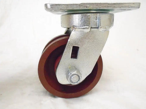 Built Tough Heavy Duty Swivel And Rigid Caster Set Featuring 4 Inch By 2 Inch Ductile Steel Wheels Kingpinless Design close-up of a swivel caster with a 4 inch burgundy wheel.
