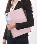 Person holding 60 Pocket Portfolio Binder Organizer With Clear Sheet Protectors For 8.5 By 11 Inches Documents Holds 120 Pages Handy Office School Art And Concert Binder Pink Pro Grade Organization