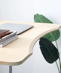 No Sweat Height Adjustable Laptop Desk with Smooth Glide Casters, Chic Minimalist Overbed Table close-up showing glossy surface and books.