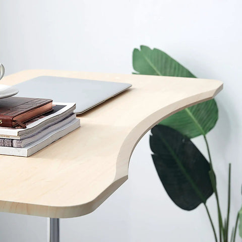 No Sweat Height Adjustable Laptop Desk with Smooth Glide Casters, Chic Minimalist Overbed Table close-up showing glossy surface and books.