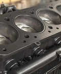 Close-up of an engine block part cleaned with Self Emulsifying Solvent Degreaser For Heavy Grease And Grime Cleanup, 5 Gallon Industrial Degreaser