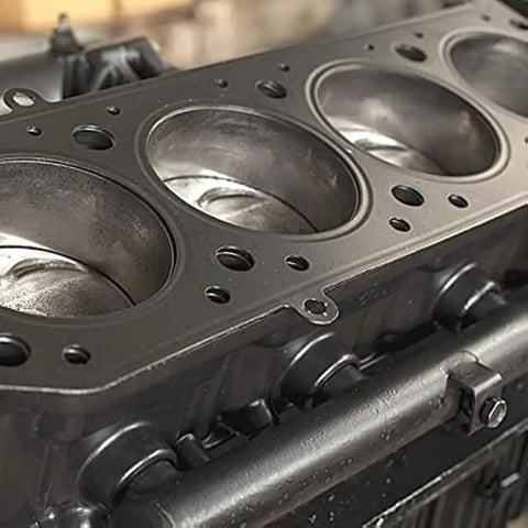Close-up of an engine block part cleaned with Self Emulsifying Solvent Degreaser For Heavy Grease And Grime Cleanup, 5 Gallon Industrial Degreaser