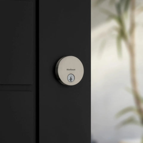 Uptown Deadbolt Lock In Satin Nickel For Exterior Front Door, Pick Resistant SmartKey Rekey Security, displayed on a modern door