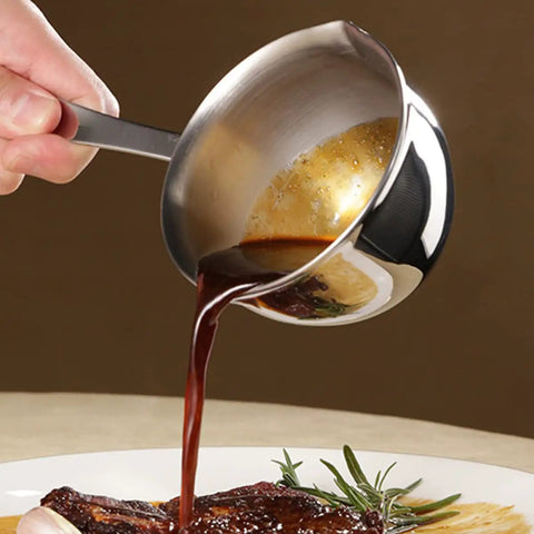 Slick Melting Pot With Pour Spout For Hot Coffee Chocolate And Soups Fire Kitchen Warmer Bowl pouring sauce onto a dish.