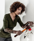 Person using Soft Face Mallet Workhorse With Dual Inserts Black Medium Hard Rubber Insert And Red Hard Plastic Insert Cast Iron Housing