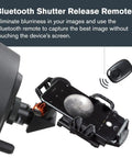 NexGO DX All In One Universal Smartphone Adapter For Telescope Binoculars And Spotting Scopes With Two Axis Precision Alignment shown with Bluetooth remote.