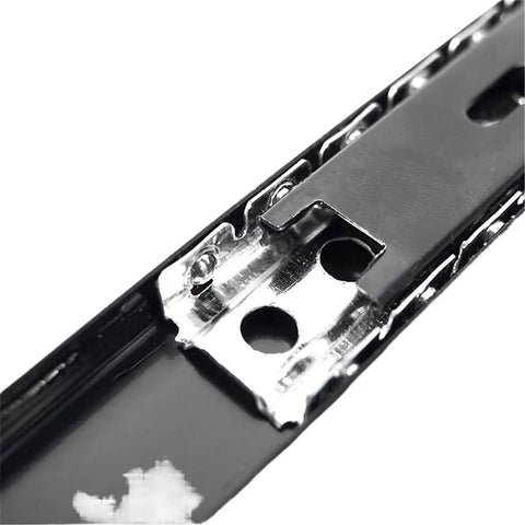 Close-up of zinc plated metal on heavy duty black 27mm ball bearing drawer slide for kitchen cabinets, showing smooth glide mechanism.