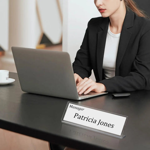 Woman working on laptop with Clear Acrylic Desk Name Plates 2 By 8 Inch Name Tents Pack Of 60 For Classroom Office Meetings displayed