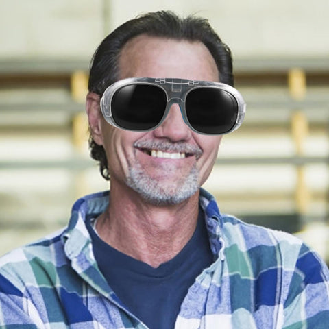 Boss Grade Welding Protective Glasses With Flexible Splash Visor And Full Spectrum Dust Control Black Gray Optical Lens worn by smiling tradesman.