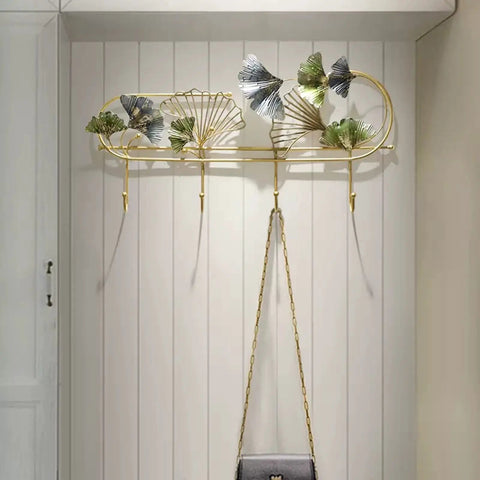 Heavy Duty Wall Mounted Coat Rack With Sturdy Hooks For Draping Jackets Hats And Outerwear In The Entryway Hallway Bedroom, gold metal with decorative leaves.