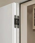 Close-up view of Heavy Duty Invisible Hydraulic Hinges 3 Pack 170 Degree Self Closing Concealed Door Hardware mounted on door.