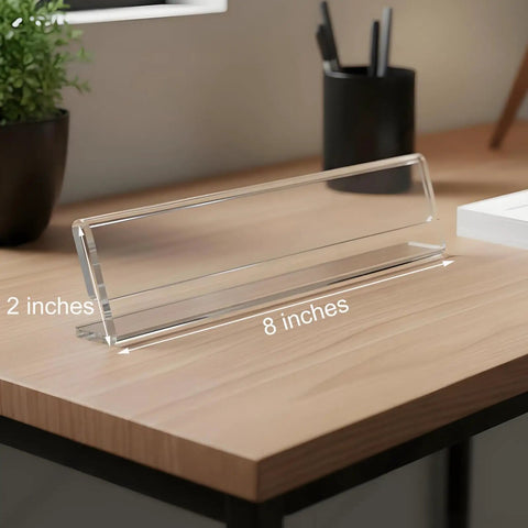 Clear Acrylic Desk Name Plates 12 Pack With Horizontal Slant Back 2x8 Sign Holders on wooden desk, tent style display.