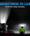 All Purpose Ebike Headlight With 2 Pin Waterproof Connector showcased, illuminating road in city ride at 30 Lux brightness.