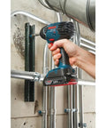 Person using Compact 18V One Quarter Inch Hex Impact Driver Bare Tool With Built In LED Light for tight spaces