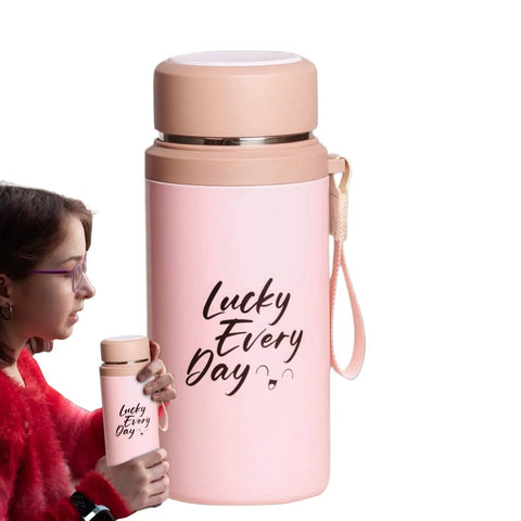 Woman holding pink 800ml insulated water bottle with tea infuser, vacuum-sealed leakproof stainless steel flask for gym, travel, hiking.