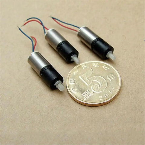Ultra Tiny 6mm DC 3V Mini Planetary Gear Motor With 1 To 26 Gearbox 1200 RPM Coreless Drive next to coin for scale