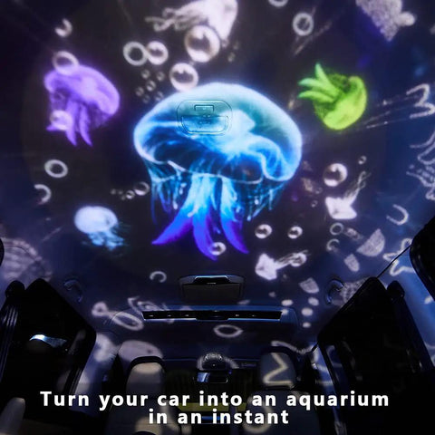 Starry Night Light Projector For Kids Dual Mode Sea And Galaxy Nebula displaying ocean creatures in a car interior