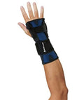 X Stay Wrist Stabilizer For Adults Black Adjustable Wrist Wrap displayed on a left hand, providing snug support for wrist pain.