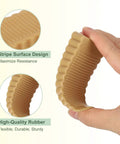 Hand holding six pack rubber door stoppers for bottom of door 15mm anti slip wedge stackable orange door stops to guard floors.