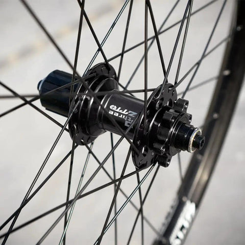 Close-up of a hub on the All Terrain Mountain Bike Wheelset For 29, 27, And 26 Inch Rims, showcasing durable aluminum and 142 hub.