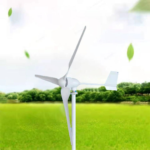 Front view of a white wind turbine with three nylon blades on a tall pole in a green field