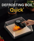 Electric Smart Defrosting Tray With Clear Visual Lid And Usb Power For Lightning Fast Meat Thawing High Conductivity Aluminum Base in use with chicken breast.