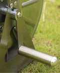 Close-up of heavy duty stainless steel garden hose reel crank handle for smooth rollup, on grassy surface.