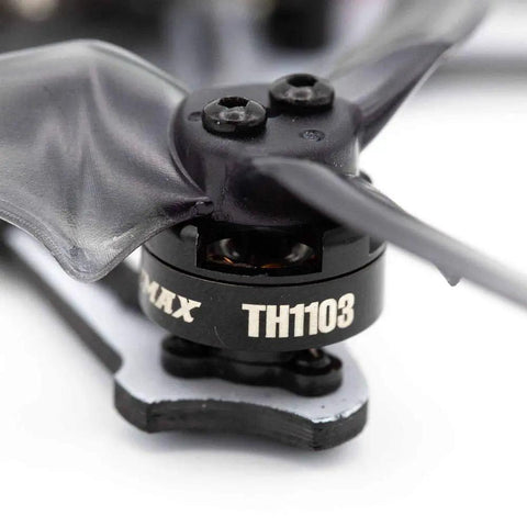 Close-up of TH1103 7000KV brushless motor for 1to2S Tinyhawk freestyle 115mm racing drones, black T-mount propeller attached.
