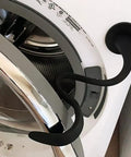 Premium Magnetic Washer Door Prop For Front Load Washers Keeps Gasket Dry And Fresh By Holding Door Ajar with black flexible hose.